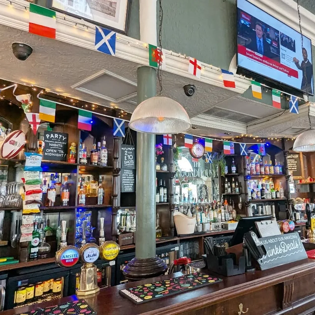 The Round House bar interior with hand pumps and back bar