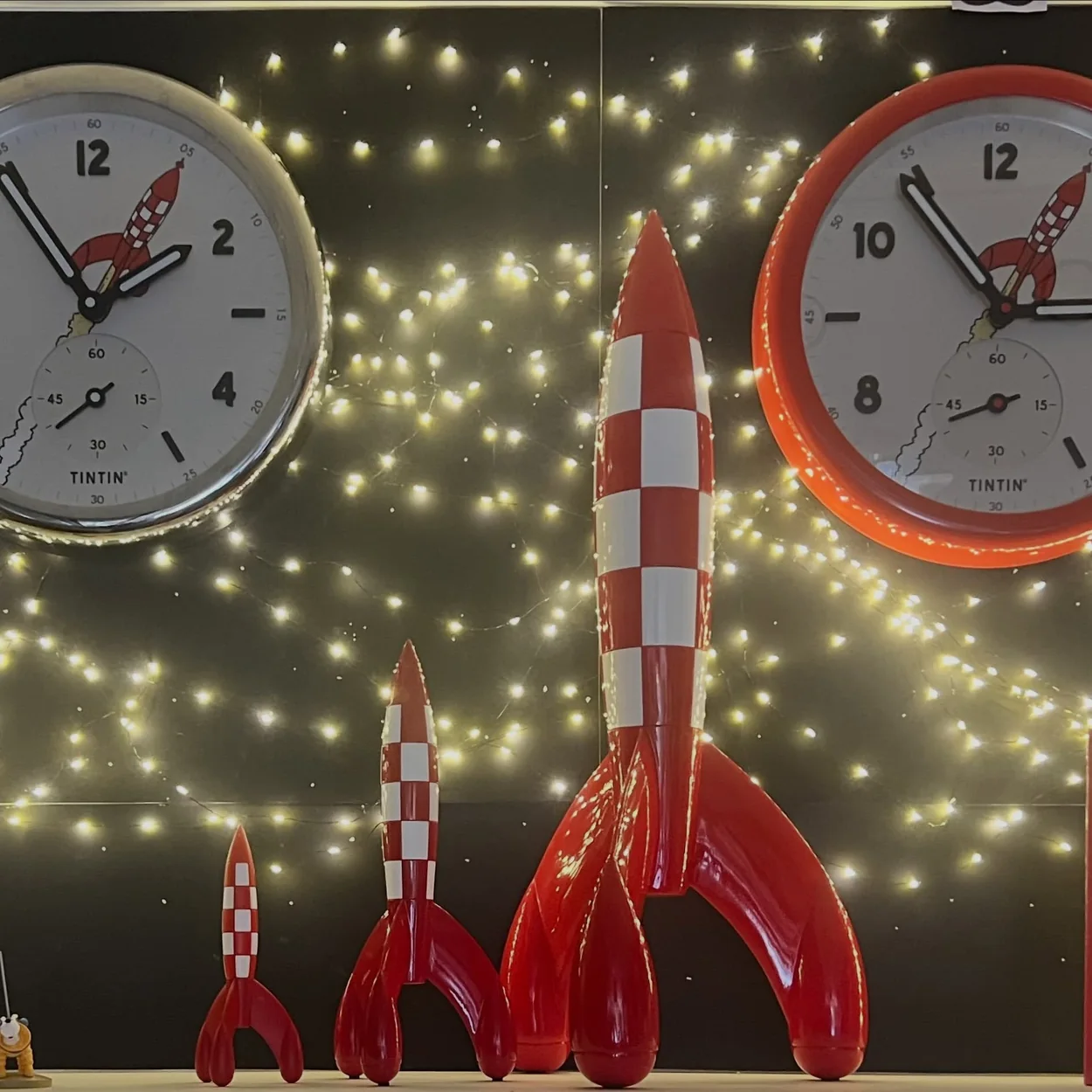 The Tintin Shop window display with rocket models and clocks