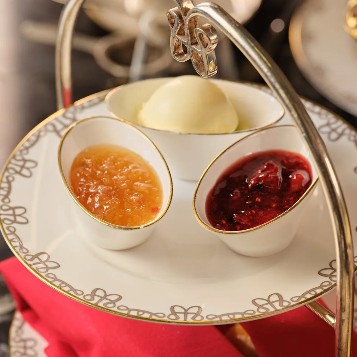The Waldorf Hilton afternoon tea stand with scones, jam and clotted cream