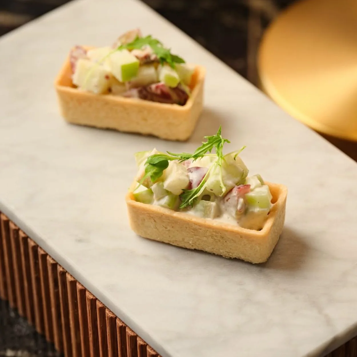 The Waldorf Hilton canapes served on a marble bar top