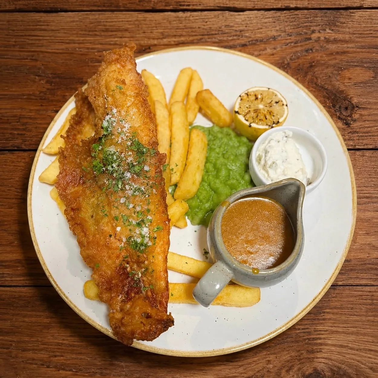 The White Lion battered fish with chips, mushy peas and tartare sauce