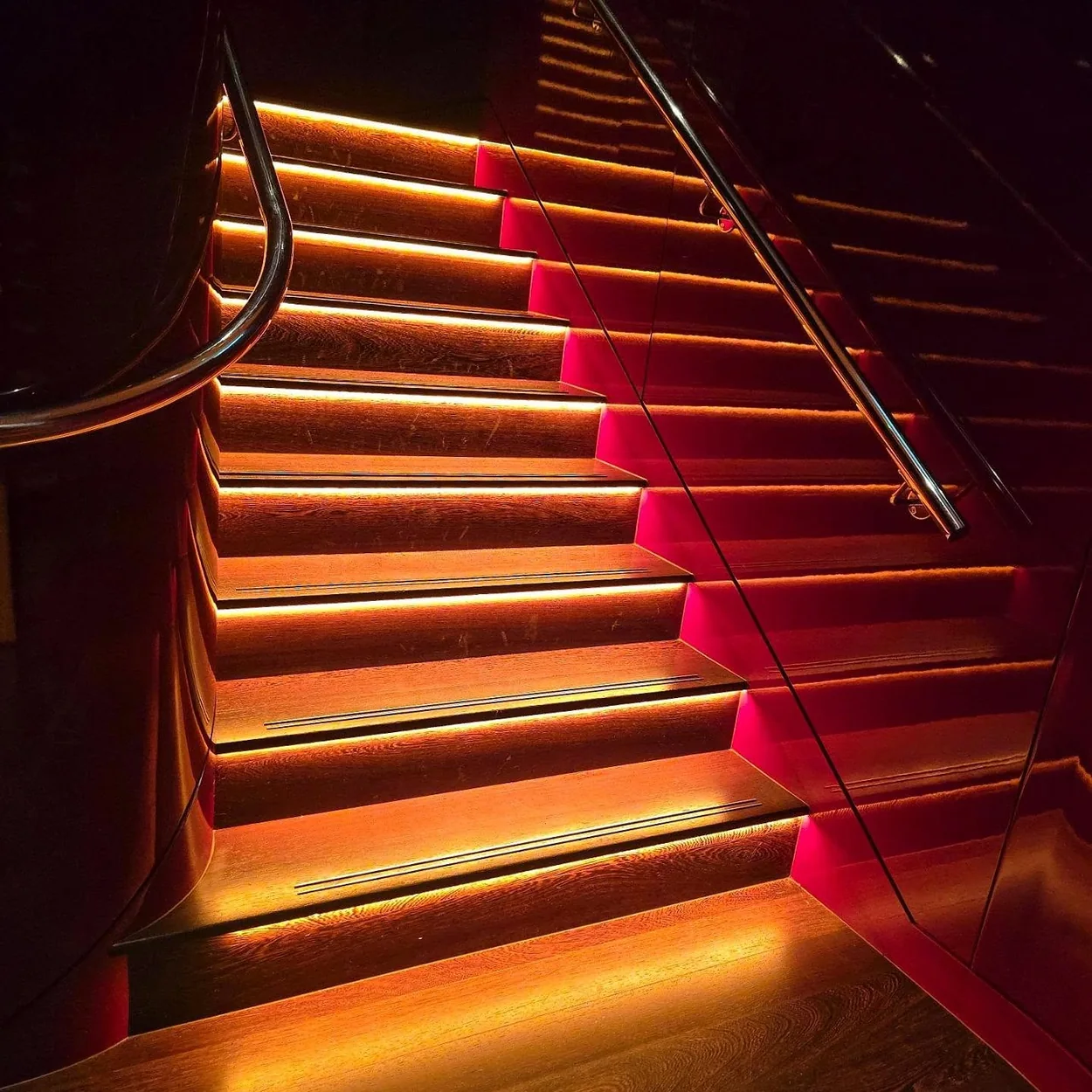 Town restaurant lit staircase to the lower floor