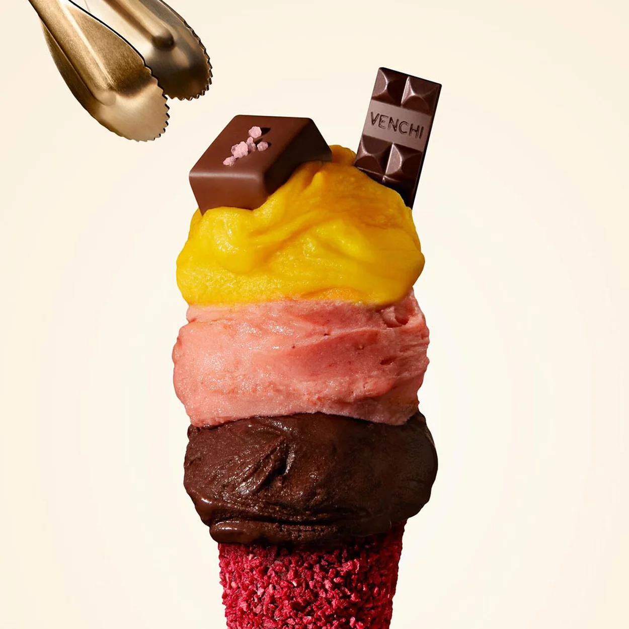 Venchi triple-scoop gelato cone with mango, strawberry and dark chocolate