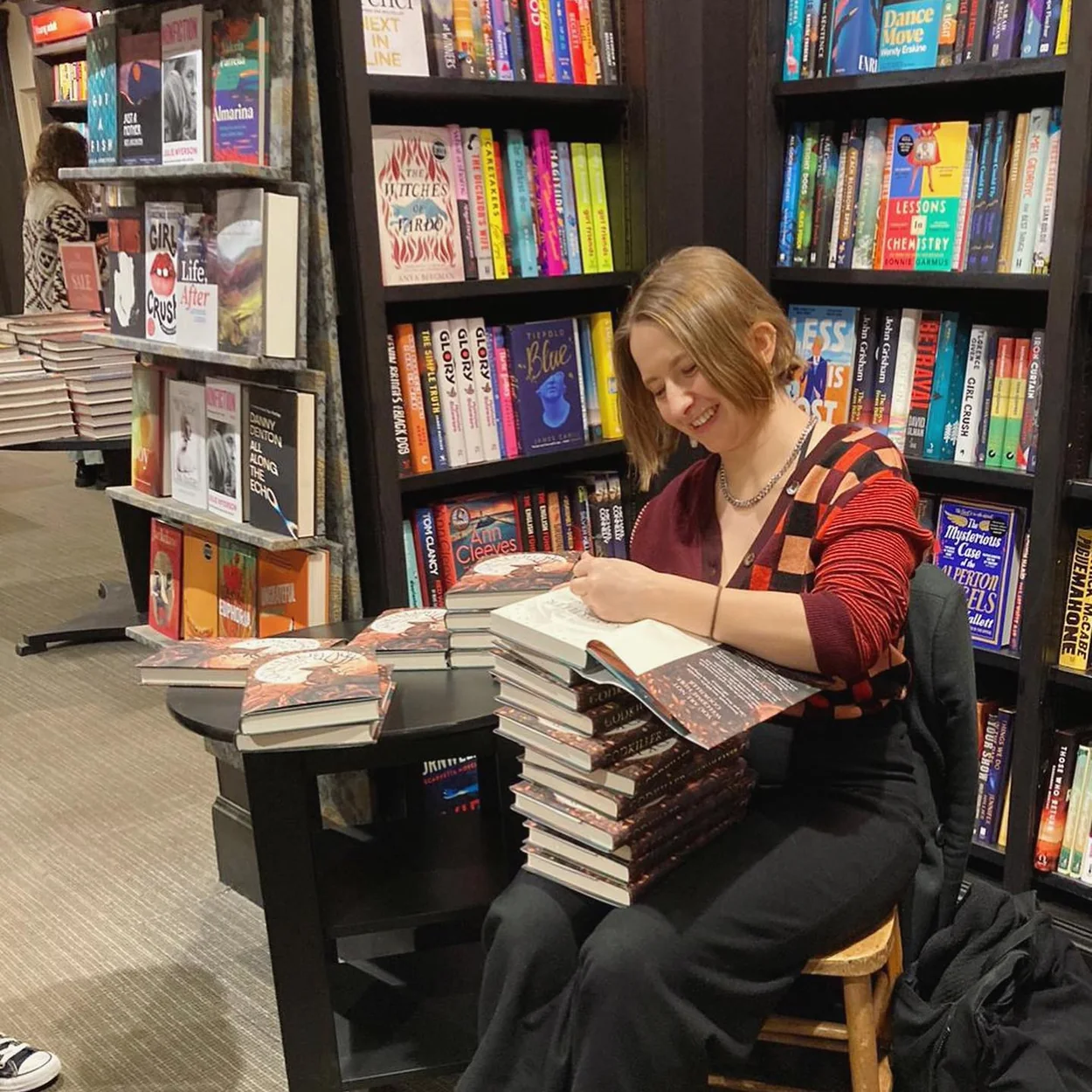 Waterstones Covent Garden author signing books among the shelves