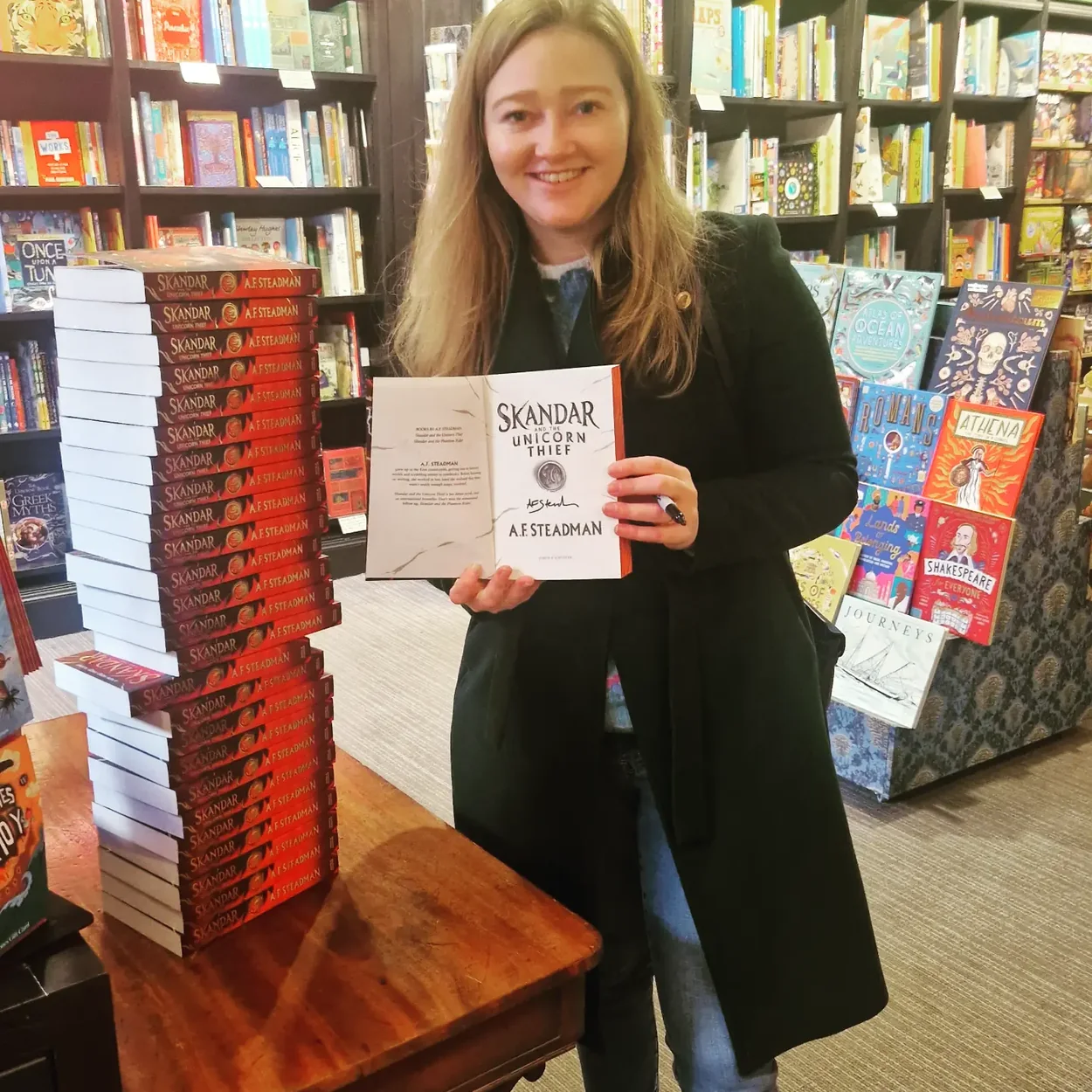 Waterstones Covent Garden author event with signed stock on the table