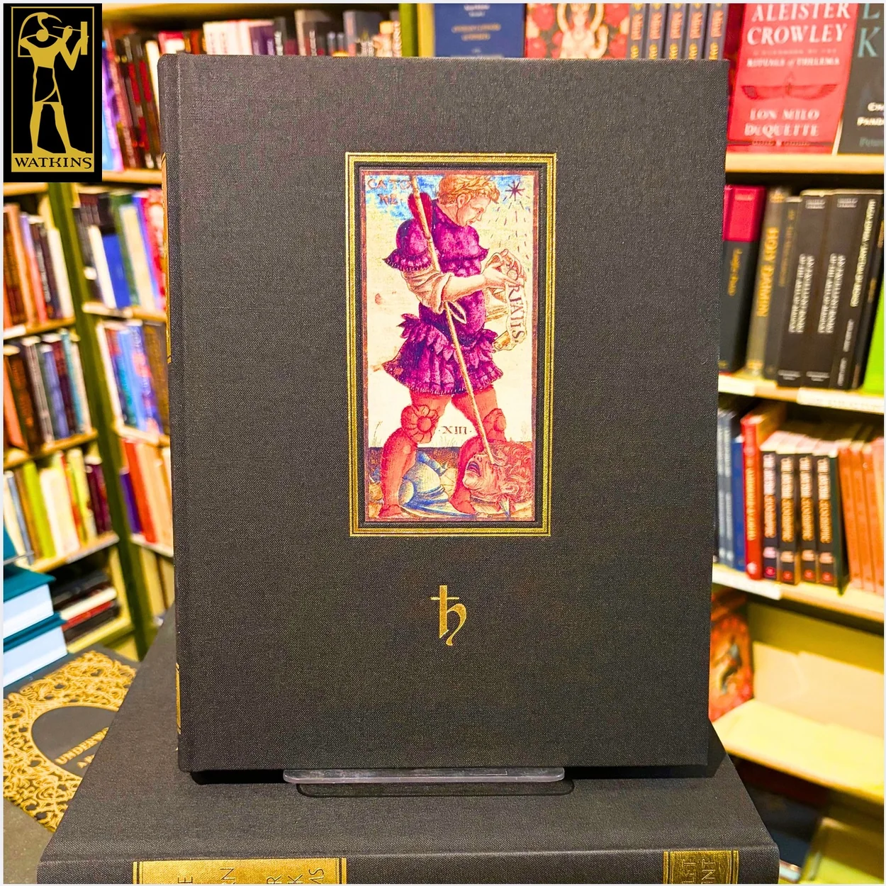 Watkins Books black clothbound tarot volume on display