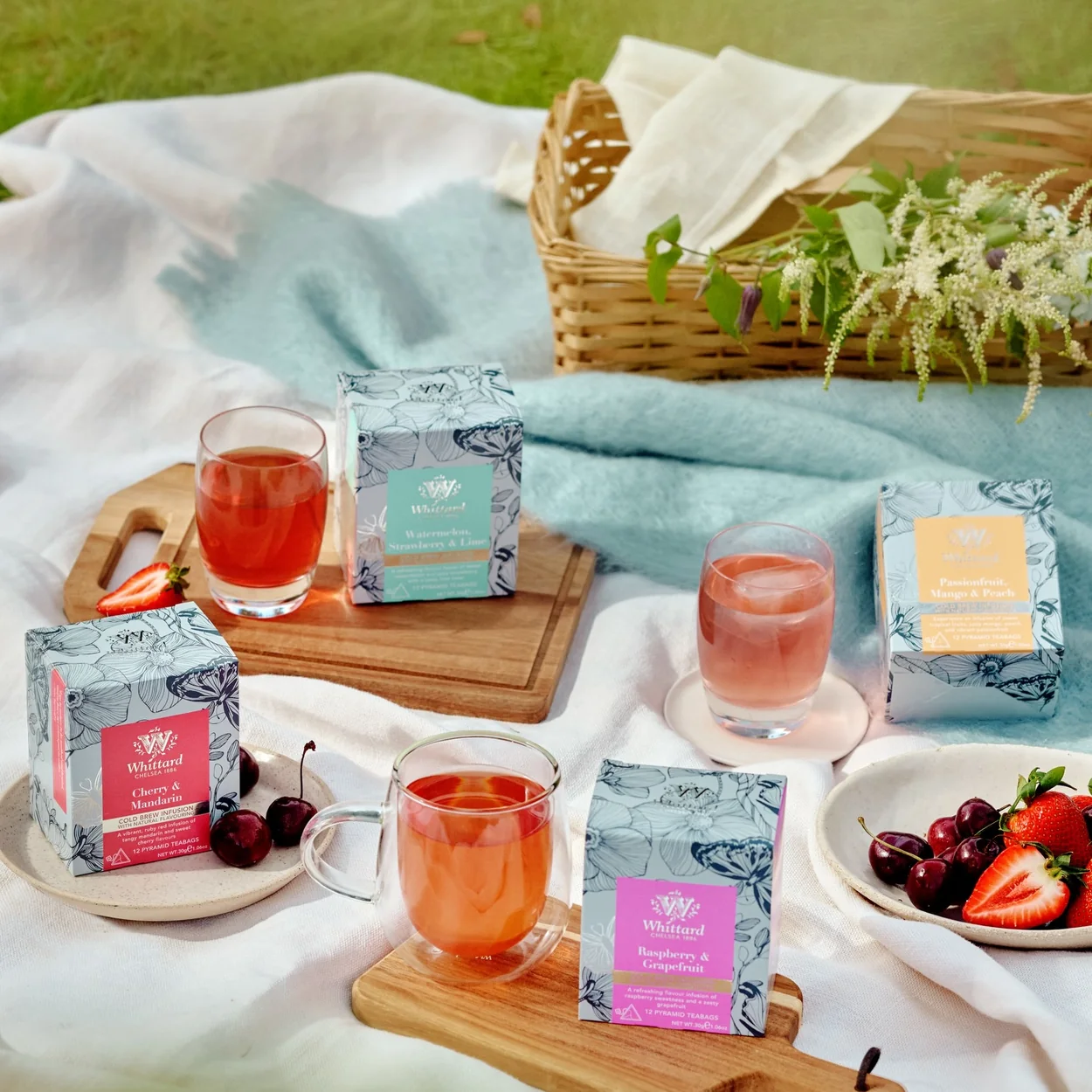 Whittard of Chelsea tea boxes and iced tea on a picnic blanket