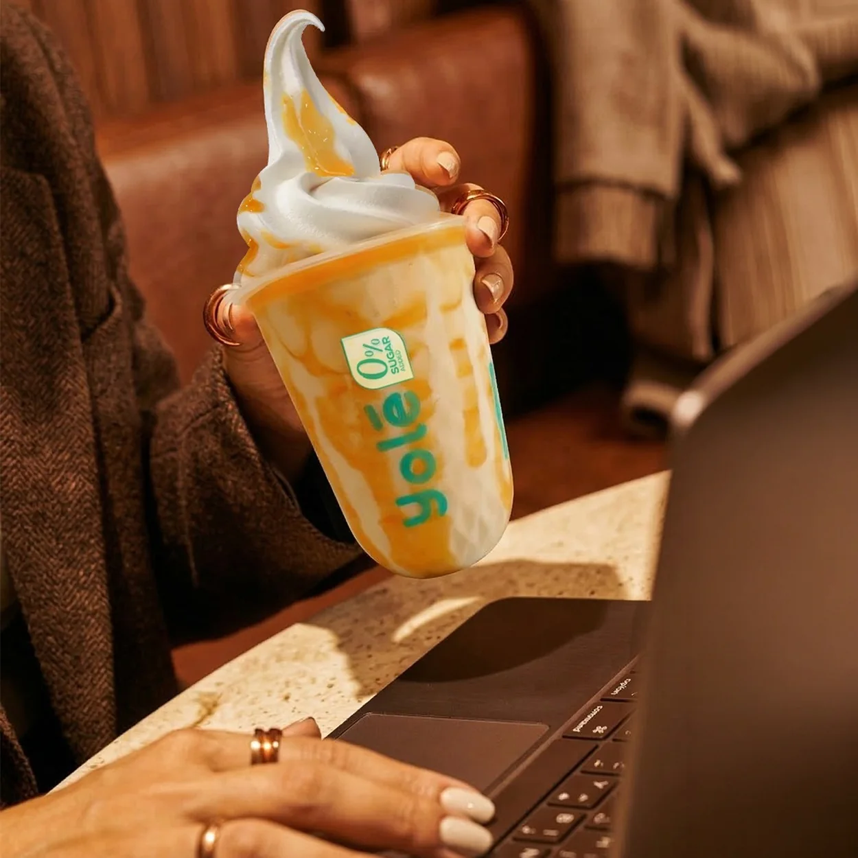 Yole soft serve cup enjoyed at a cafe table