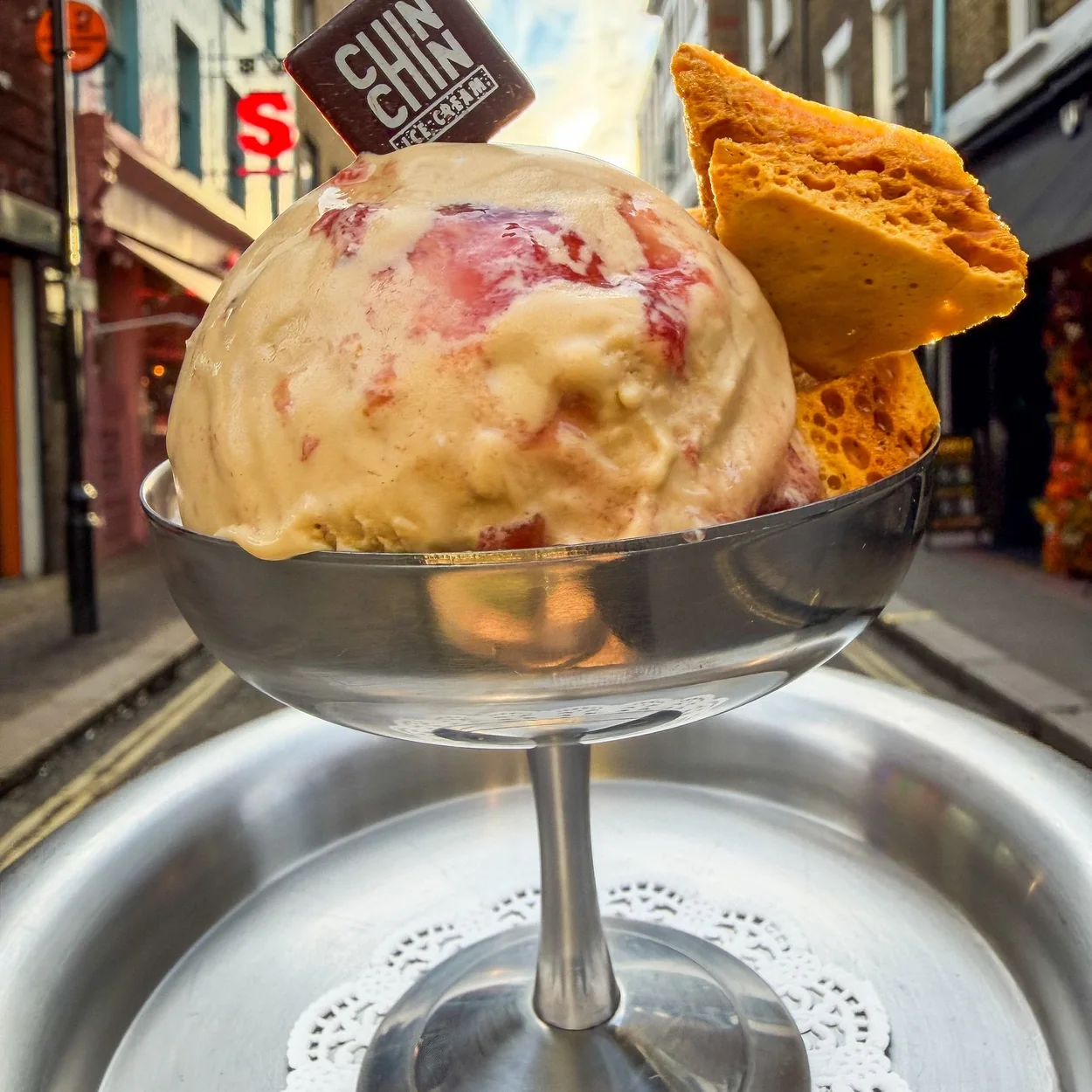 Scoop of ice cream in a coupe glass with a wafer at Chin Chin Ice Cream