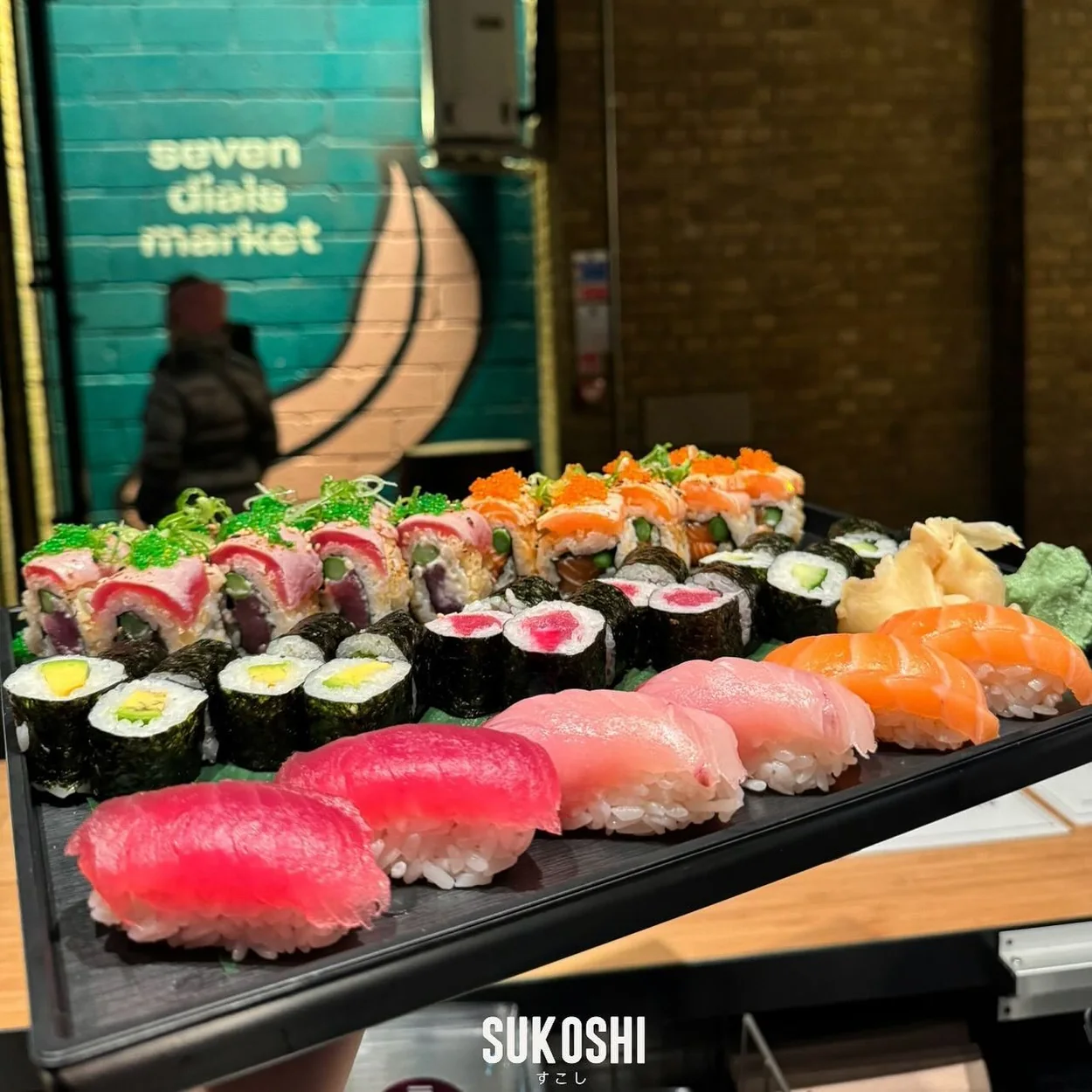 Chilled counter display of nigiri and maki sushi at Sukoshi