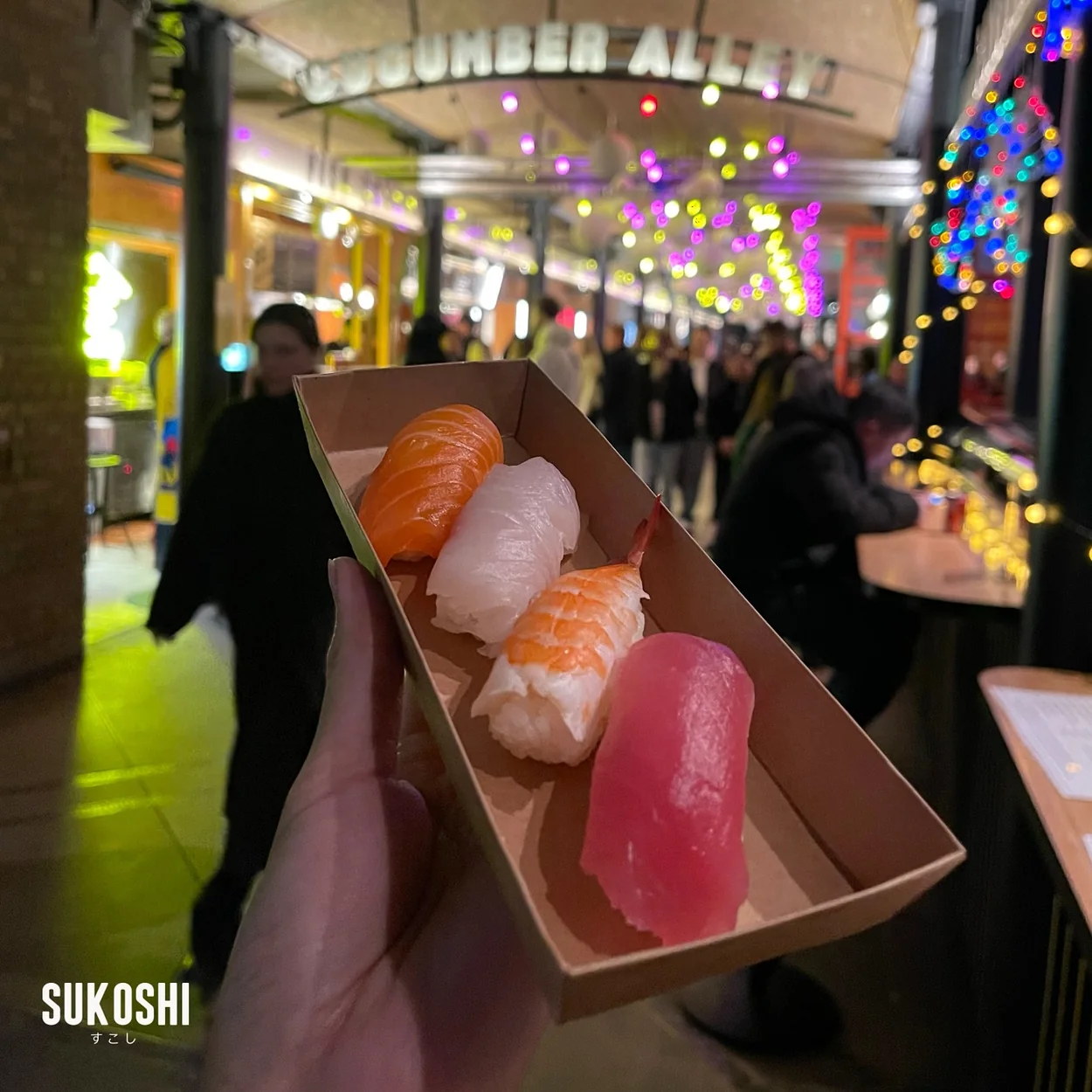 Tray of salmon and tuna nigiri held inside Seven Dials Market