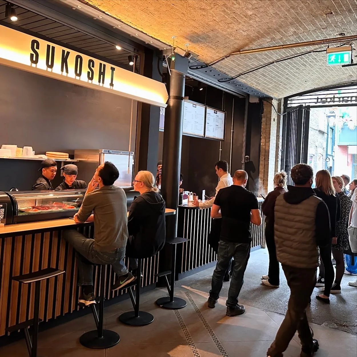 Diners at the Sukoshi counter inside Seven Dials Market